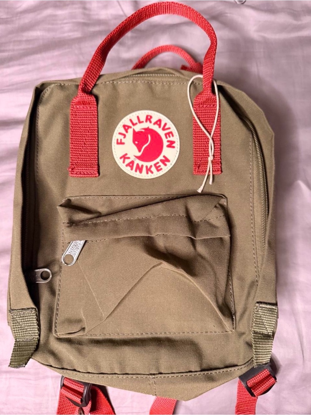 Fjällräven Kånken Mini backpack in olive green with red straps. #kanken #mini